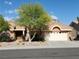 Charming single-story home featuring a well-maintained landscape and inviting curb appeal with a two car garage at 2540 Faiss Dr, Las Vegas, NV 89134