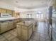 Spacious kitchen with stone countertops, modern appliances, and tile floors at 2540 Faiss Dr, Las Vegas, NV 89134