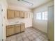 Functional laundry area offering cabinetry for storage and a built-in sink at 2540 Faiss Dr, Las Vegas, NV 89134