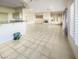 Bright living room with fireplace, built-in shelving, and tile floors at 2540 Faiss Dr, Las Vegas, NV 89134