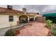 Backyard view showcases covered patio, brick pavers, and desert landscaping, offering a private outdoor space at 2595 Fort Lauderdale Dr, Las Vegas, NV 89156