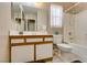Bright bathroom featuring a vanity with drawers and a toilet adjacent to a shower and tub at 2595 Fort Lauderdale Dr, Las Vegas, NV 89156
