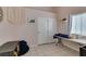 Neutral toned bedroom featuring a closet with white sliding doors and a tiled floor at 2595 Fort Lauderdale Dr, Las Vegas, NV 89156