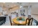 Bright dining area with a round table, white cabinets, and tiled floors at 2595 Fort Lauderdale Dr, Las Vegas, NV 89156