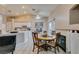 Dining area with a round table, view of kitchen, and neutral decor at 2595 Fort Lauderdale Dr, Las Vegas, NV 89156