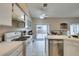Bright kitchen with tiled countertops and modern appliances, with access to an outdoor patio area for easy entertaining at 2595 Fort Lauderdale Dr, Las Vegas, NV 89156