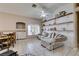 Open-concept living room with vaulted ceilings, a ceiling fan, and bright windows at 2595 Fort Lauderdale Dr, Las Vegas, NV 89156