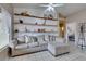 Inviting living room featuring a comfortable sectional sofa and stylish shelving at 2595 Fort Lauderdale Dr, Las Vegas, NV 89156