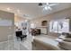 Spacious living area featuring tiled floors, a ceiling fan, fireplace, and a comfortable sofa at 2595 Fort Lauderdale Dr, Las Vegas, NV 89156