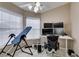 Home office featuring natural light from the window, a workspace with multiple monitors, and an inversion table at 2595 Fort Lauderdale Dr, Las Vegas, NV 89156