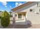 Back patio features columns and a door to inside at 2605 Lotus Hill Dr, Las Vegas, NV 89134