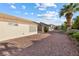 Home backyard featuring desert landscaping including shrubbery and lush trees at 2605 Lotus Hill Dr, Las Vegas, NV 89134