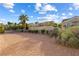 Home backyard featuring desert landscaping including trees and shrubbery at 2605 Lotus Hill Dr, Las Vegas, NV 89134