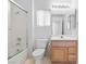 Bathroom featuring tub shower and vanity with wooden cabinets at 2605 Lotus Hill Dr, Las Vegas, NV 89134
