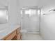 Well-lit bathroom features a shower with glass doors and a modern vanity at 2605 Lotus Hill Dr, Las Vegas, NV 89134