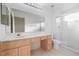 Bathroom featuring a large mirror and vanity with storage space at 2605 Lotus Hill Dr, Las Vegas, NV 89134