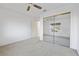 Bedroom features carpet floors, ceiling fan, and mirrored closet at 2605 Lotus Hill Dr, Las Vegas, NV 89134