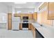 Efficient kitchen with modern appliances, ample cabinetry, and bright lighting, perfect for culinary endeavors at 2605 Lotus Hill Dr, Las Vegas, NV 89134