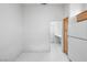 Bright kitchen with tile floors and stainless steel refrigerator at 2605 Lotus Hill Dr, Las Vegas, NV 89134