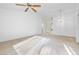 Open-concept living room featuring a ceiling fan, bright lighting, and a seamless flow to adjacent areas at 2605 Lotus Hill Dr, Las Vegas, NV 89134