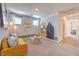 Inviting bedroom features whimsical decor, cozy seating, and natural light, creating a comfortable retreat at 2617 Snapdragon Falls Ave # 100, North Las Vegas, NV 89081