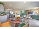 Open floor plan showcases a spacious kitchen, modern stainless appliances and adjacent living room with stylish decor at 2617 Snapdragon Falls Ave # 100, North Las Vegas, NV 89081