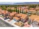 Aerial view featuring a neighborhood with desert landscaping and mature trees at 2713 Beachside Ct, Las Vegas, NV 89117