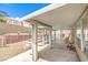 Backyard pool area under a pergola with a safety fence and patio area at 2713 Beachside Ct, Las Vegas, NV 89117