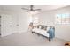 Bright bedroom with an easel and painting, modern fan and plenty of natural light at 2713 Beachside Ct, Las Vegas, NV 89117