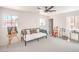 Bright bedroom with an easel and painting, modern fan and plenty of natural light at 2713 Beachside Ct, Las Vegas, NV 89117