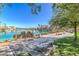 Scenic community lake with walking path offers a tranquil setting with waterfront homes and green space at 2713 Beachside Ct, Las Vegas, NV 89117
