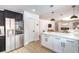 Kitchen with white and black cabinets, quartz countertops, and stainless steel appliances at 2713 Beachside Ct, Las Vegas, NV 89117