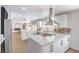 Modern kitchen with white cabinets, stainless steel appliances, and a large island at 2713 Beachside Ct, Las Vegas, NV 89117