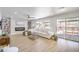 Bright living room with a modern fireplace and sliding doors to the backyard at 2713 Beachside Ct, Las Vegas, NV 89117
