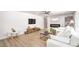 Spacious living room with a fireplace, built-in bookshelves, and a large sofa at 2713 Beachside Ct, Las Vegas, NV 89117