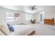 Spacious main bedroom featuring a bed, dresser, and two windows at 2713 Beachside Ct, Las Vegas, NV 89117