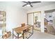 Bright home office featuring modern desk, chair, shelving, and a ceiling fan at 2713 Beachside Ct, Las Vegas, NV 89117