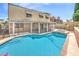 Lovely backyard pool with a spa, patio cover and view of the house at 2713 Beachside Ct, Las Vegas, NV 89117