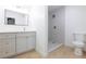 Updated bathroom with new vanity, large mirror, and tiled shower at 3151 Soaring Gulls Dr # 1053, Las Vegas, NV 89128