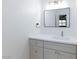 Updated bathroom featuring a modern sink, mirror and cabinet with chrome hardware at 3151 Soaring Gulls Dr # 1053, Las Vegas, NV 89128