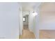 Hallway with light colored hardwood flooring and white walls throughout the property at 3151 Soaring Gulls Dr # 1053, Las Vegas, NV 89128