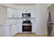Bright kitchen featuring stainless steel appliances, white cabinets, and modern countertops at 3151 Soaring Gulls Dr # 1053, Las Vegas, NV 89128