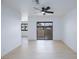 Bright living room with wood-look floors and slider to the outdoors at 3151 Soaring Gulls Dr # 1053, Las Vegas, NV 89128