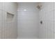 This stylish shower features white vertical tiles and a built-in niche at 3151 Soaring Gulls Dr # 1053, Las Vegas, NV 89128
