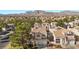 An aerial view of the home showing tile roof, desert landscaping and a lush green tree at 3425 Creek River Dr, Las Vegas, NV 89129