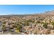 Community view with mountain backdrop showcasing rows of houses in a desert landscape at 3425 Creek River Dr, Las Vegas, NV 89129