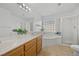 Bathroom with double sinks, vanity, soaking tub and glass enclosed shower at 3425 Creek River Dr, Las Vegas, NV 89129