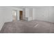 Large carpeted bedroom with multiple closets, offering space and storage at 3425 Creek River Dr, Las Vegas, NV 89129