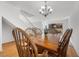 Bright dining room showcasing a wooden table with seating for six and access to the backyard at 3425 Creek River Dr, Las Vegas, NV 89129
