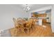 Bright dining room featuring a wooden table, chandelier and hardwood floors at 3425 Creek River Dr, Las Vegas, NV 89129